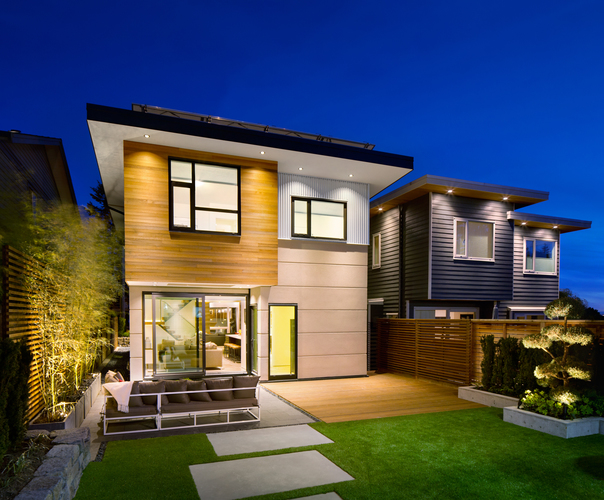 Exterior of Midori Uchi home from backyard at night