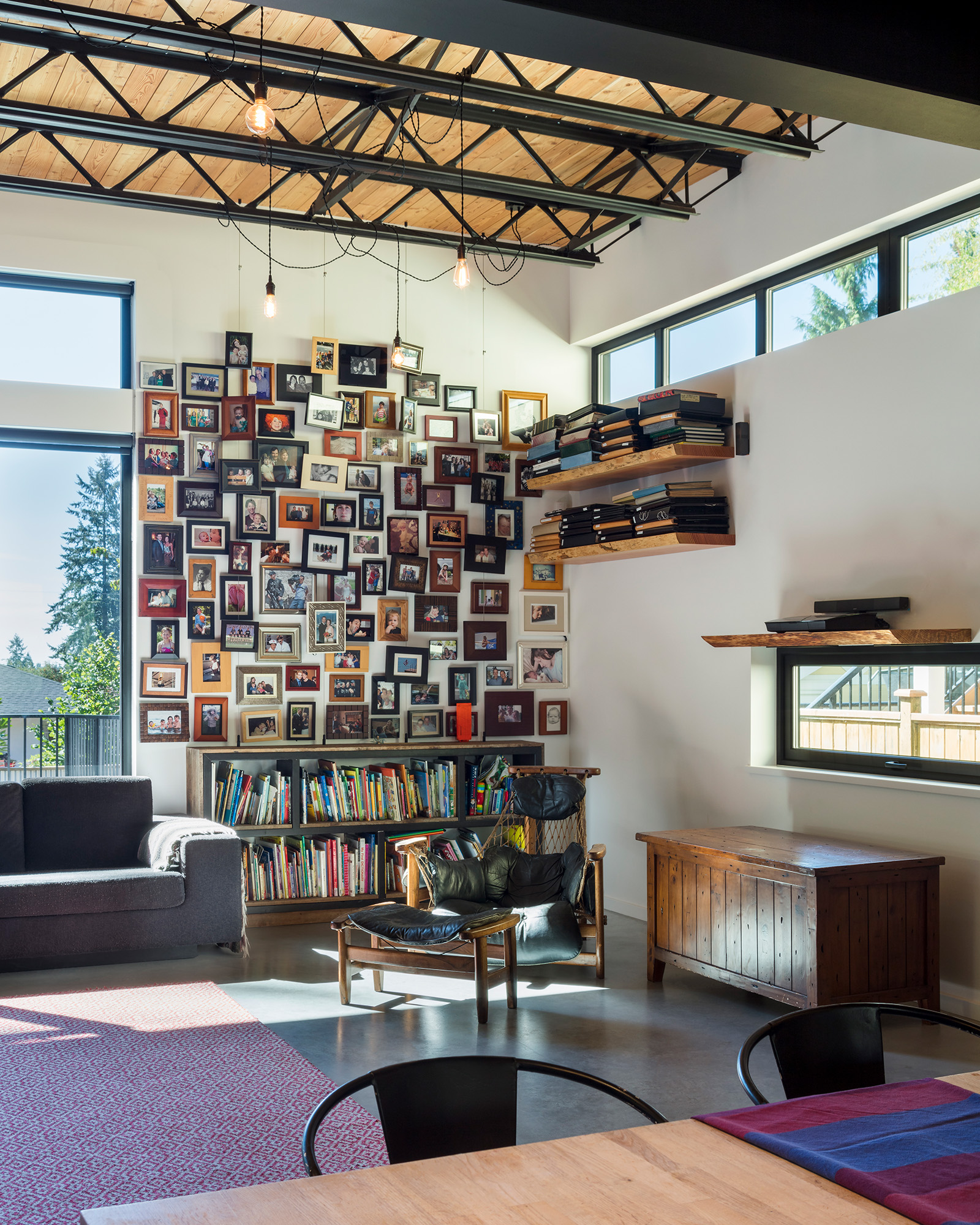 Family photos hang on an interior wall